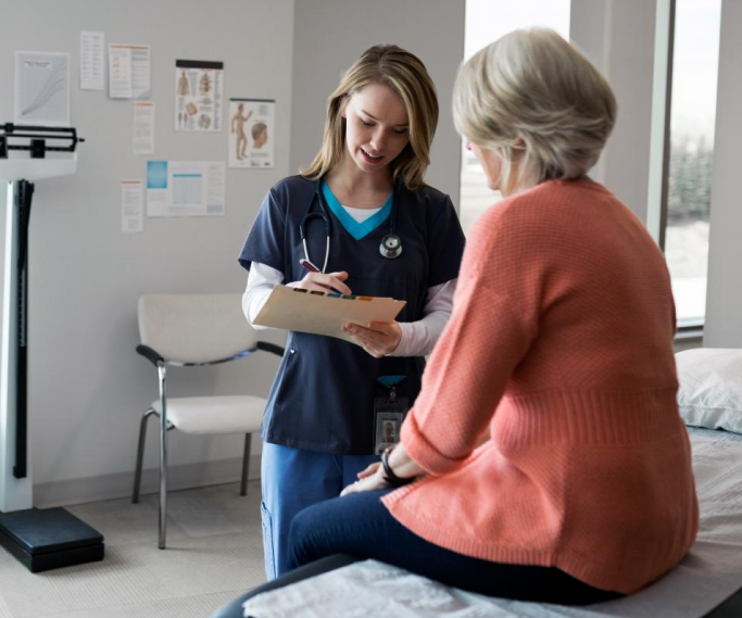 a doctor talking to a woman about a inguinal hernia 1